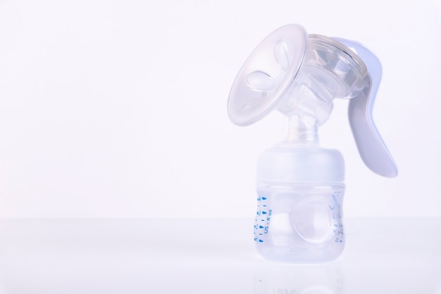 Manual breast pump. Copy space