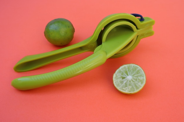 A manual citrus press with lime