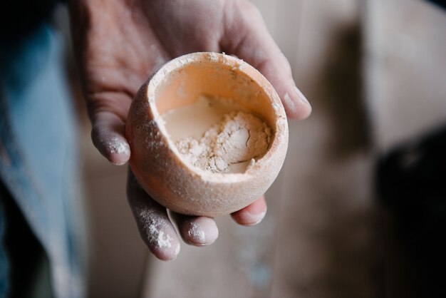 Manually mixing gypsum and water