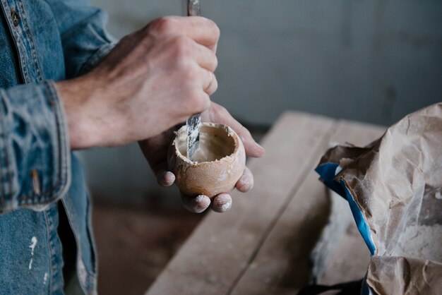 Manually mixing gypsum and water