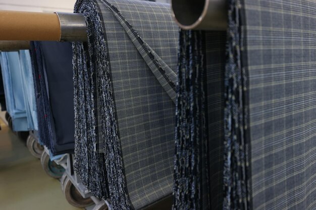 The manufactured fabrics are in rolls at the factory modern\
production line