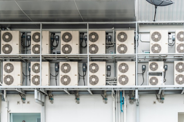 Many air conditioners units compressor are attached to the sides of large buildings for cooling.