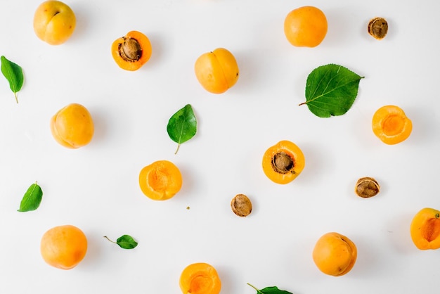 Many apricots on the white background. Top view