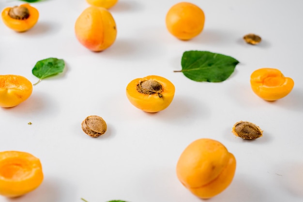 Many apricots on the white background. Top view