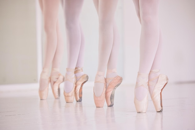 Many ballet feet legs or tiptoe of elegant dancers dancing and practicing in a dance studio Closeup of ballerinas or performers or team preparing or learning for a group performance in a class