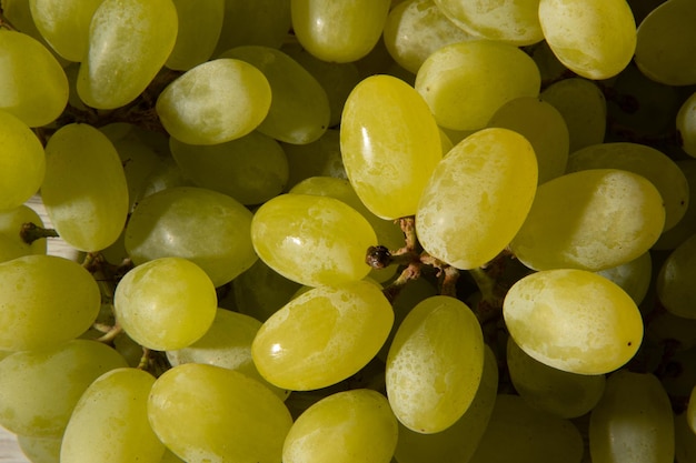 Many berries of white grapes Juicy white grapes Grapes Texture