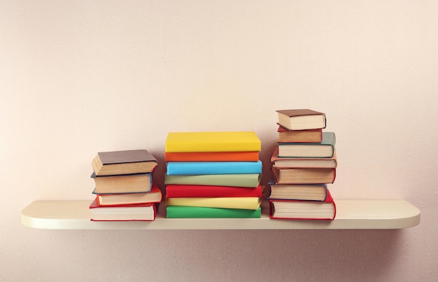 many books on wooden shelf