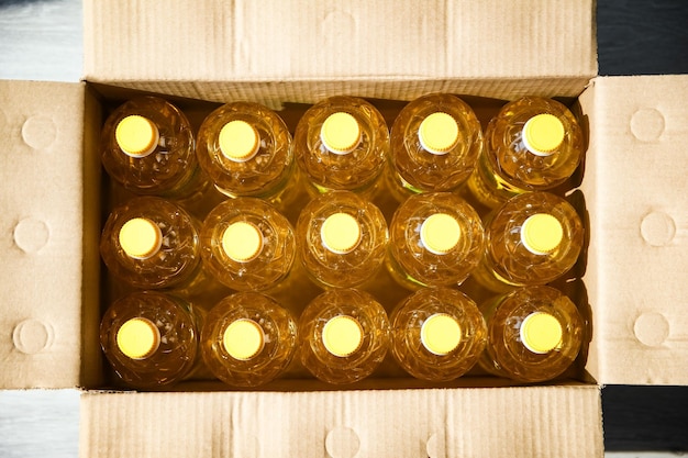 Many bottles of sunflower oil background