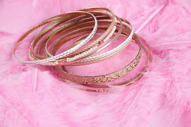 Many bracelets on pink