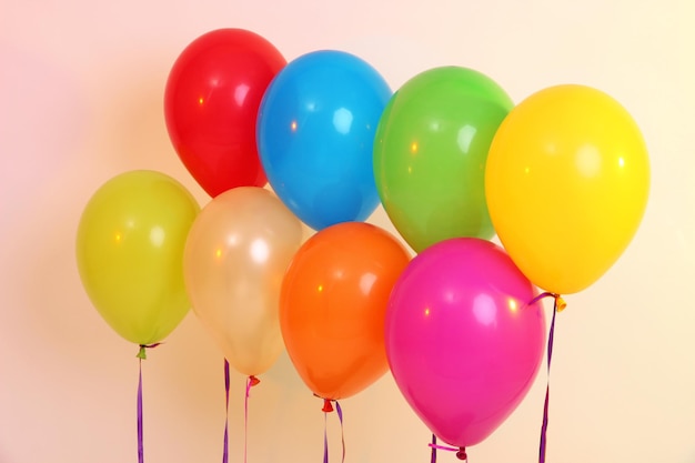 Many bright balloons on orange background