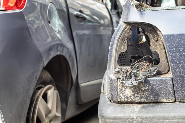 Many broken cars after a traffic accident in the parking lot of a restoration service station