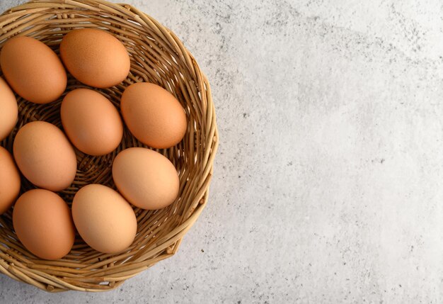 many brown eggs several in a wicker basket