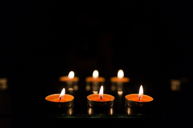 Many burning candles with shallow depth of field