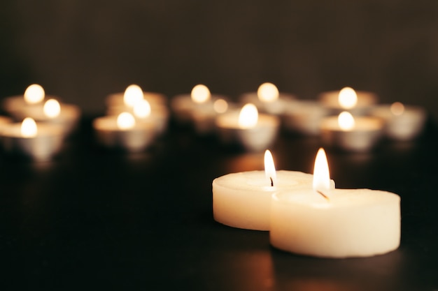 many burning candles with shallow depth of field