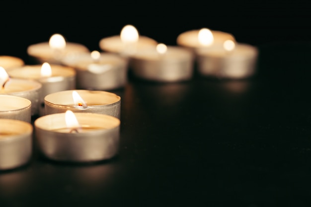 Many burning candles with shallow depth of field