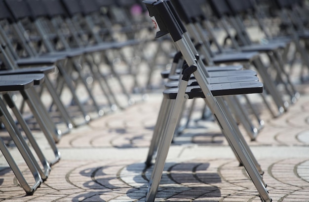 Many chairs arranged in an outdoor plaza