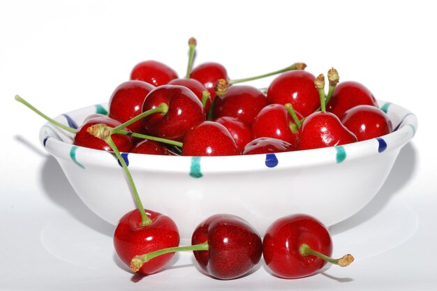 Many cherries  in a bowl