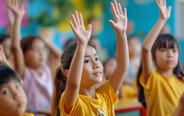 Many children in the classroom raising their hands Kid learning