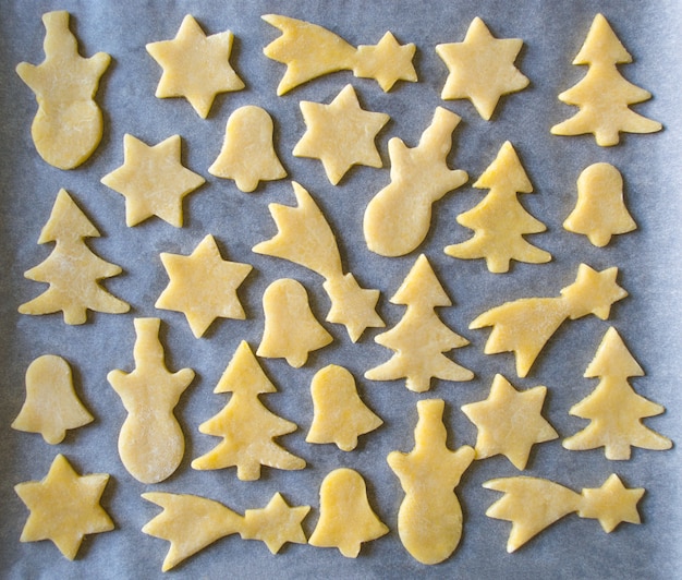 Many Christmas ginger biscuits on a baking. Preparing for Christmas. cooking Christmas gingerbread