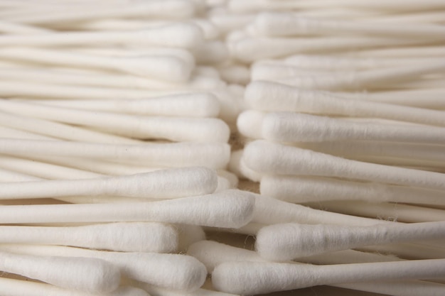 Many clean cotton buds as background closeup