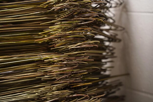 Many coat hangers in storage room hook close up