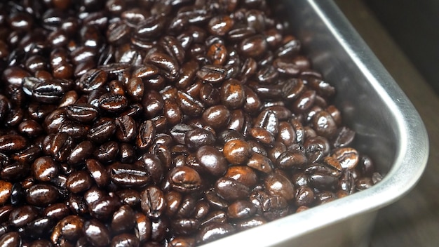 many coffee beans from excellent source around the world in silver metal tray which special handmade