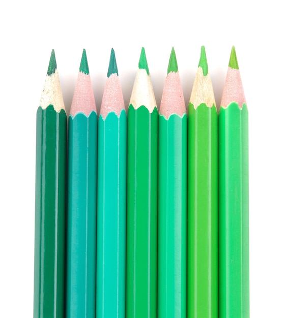 Many color pencils on white isolated background. close-up. stationery.