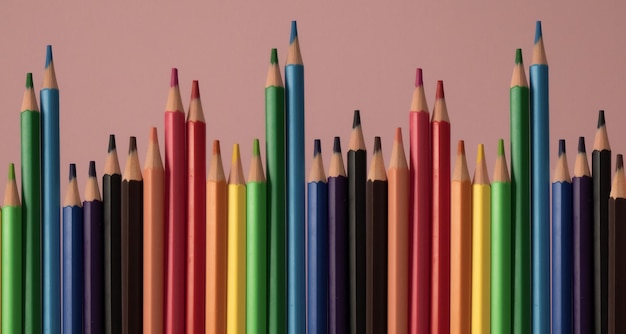 Many colored pencils on top of each other
