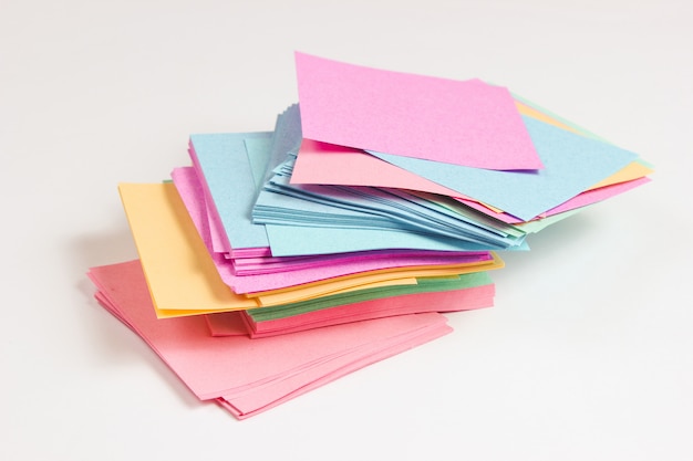 Many colored sticky notes isolated on white