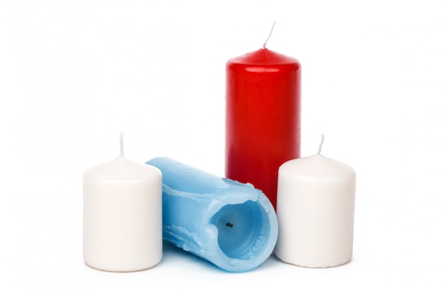 Many colorful candles isolated on white 