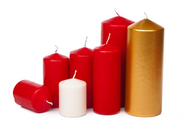 Many colorful candles  on white background