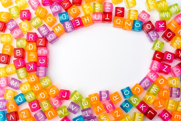 Many colorful decorative cubes with letters on a white background