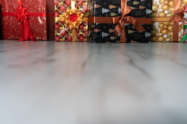 Many colorful gift boxes are lying on the floor Christmas atmosphere