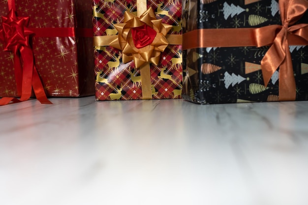 Many colorful gift boxes are lying on the floor Christmas atmosphere