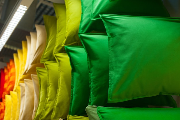 Many colorful pillows on shelves