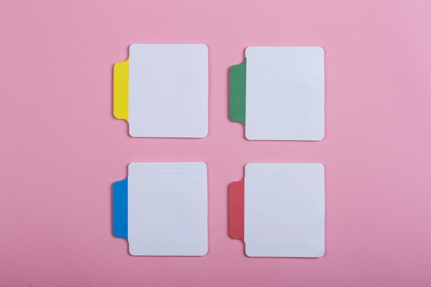 Many colorful sticky note on pink background