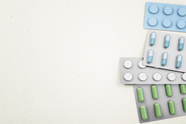 Many colors tablets in a package on white background Medicine and illness concept Mock up 3D Rendering