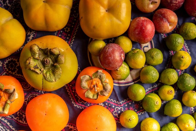 Many colors and varieties of fruits are on the wood grain table