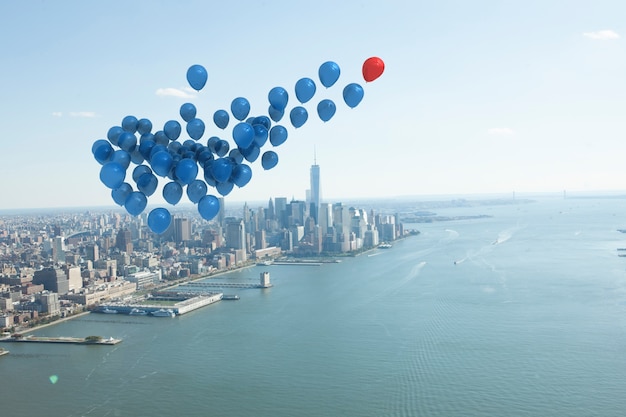 Many colourful balloons above coast