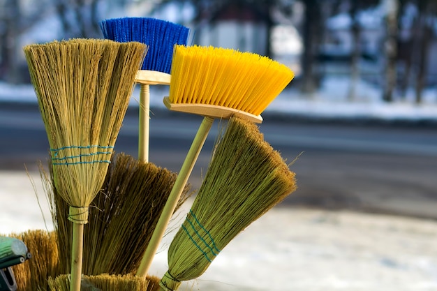 Many different brooms and floor brushes for sale