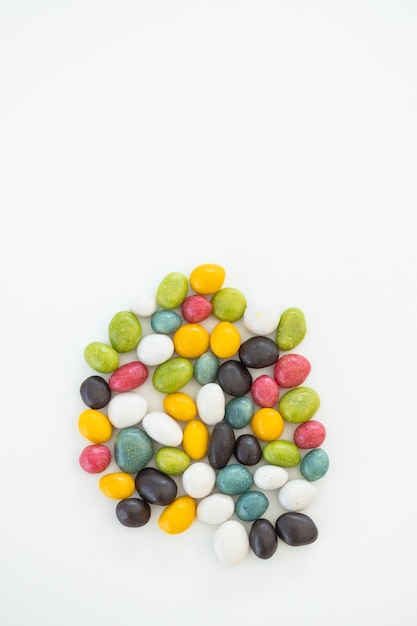 Many different candies sweets on white background