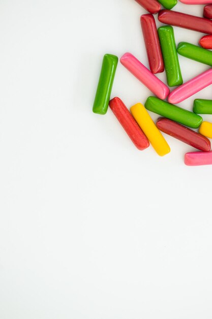 Many different candies sweets on white background