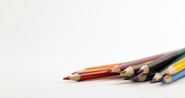 Many different colored pencils closeup isolated on white background