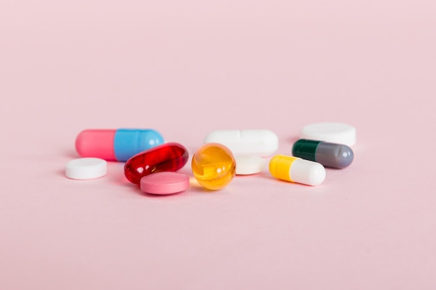 Many different colorful medication and pills perspective view Set of many pills on colored background