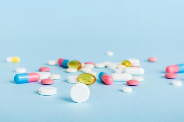 many different colorful medication and pills perspective view set of many pills on colored background