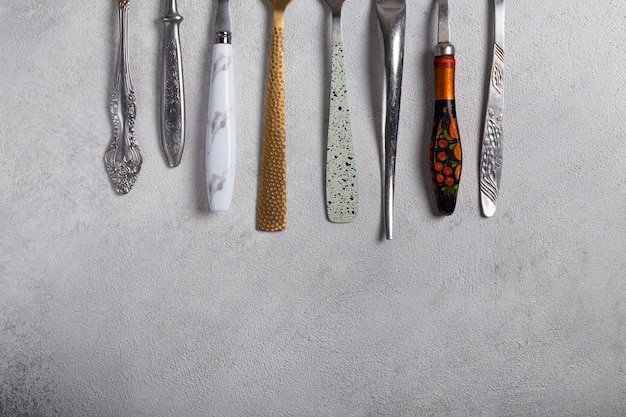 Many different forks on a light background