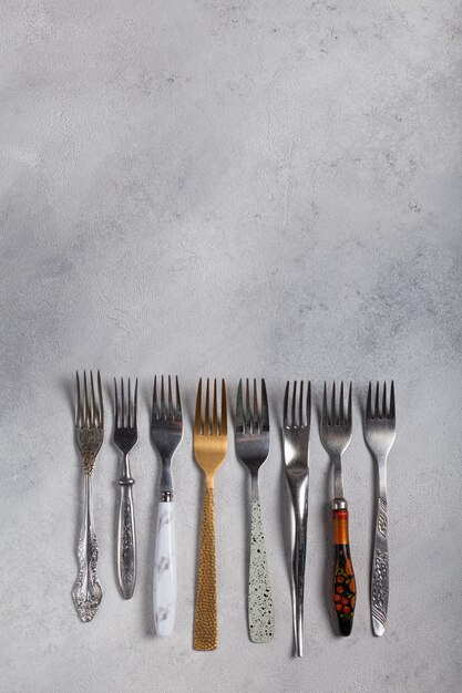 Many different forks on a light background
