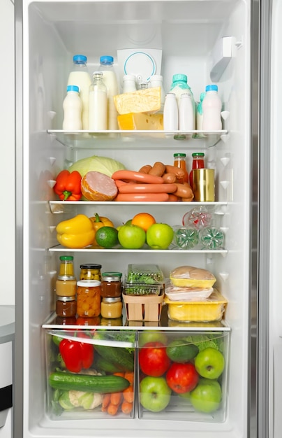 many different fresh products in modern refrigerator