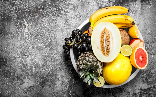 Many different fruits in a large bowl.