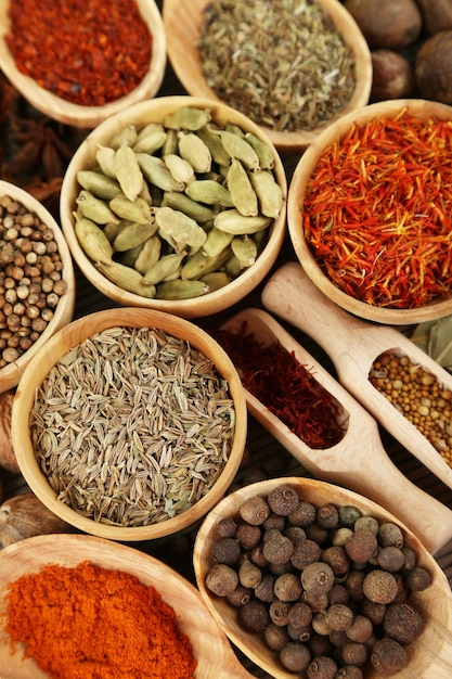 Many different spices and fragrant herbs closeup background